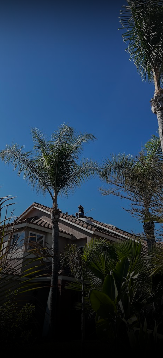 Clean solar panels on a roof with a clear blue blue sky (mobile)